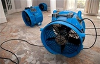 Large Fans Drying Previously Flooded Home