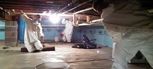 Technicians perform mold remediation in a crawl space